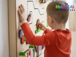 Child playing with activity board